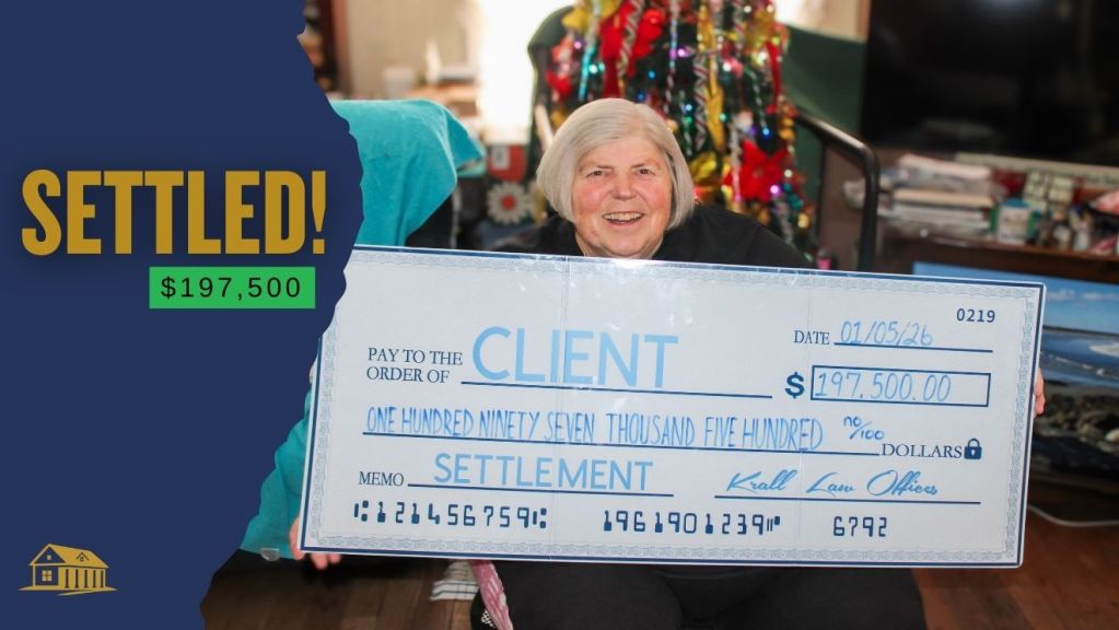 Client holding a settlement check for $197,500