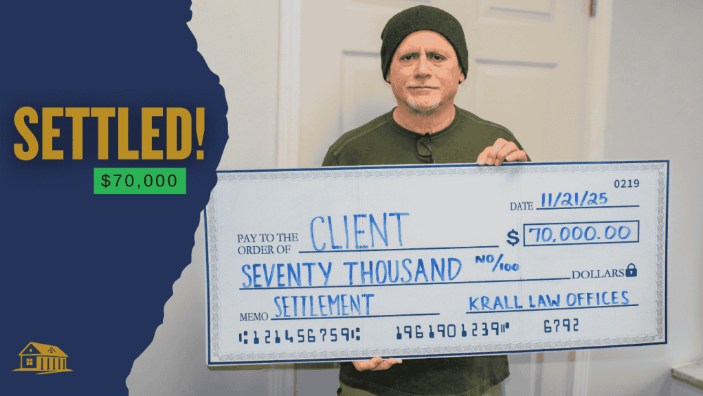 Client holding a settlement check for $70,000